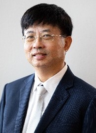A person in a suit and tieDescription automatically generated